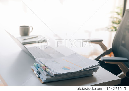 Office workplace with laptop and smart phone on wood table Office workplace with laptop and smart phone on wood table 114275645