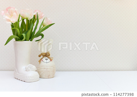 bouquet of tulips and Easter bunny on white table. copy space 114277398