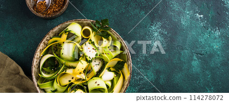 Raw sliced zucchini vegan pasta or salad. 114278072