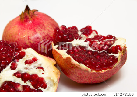 Purified pomegranate fruit on a white background Purified pomegranate fruit on a white background 114278196