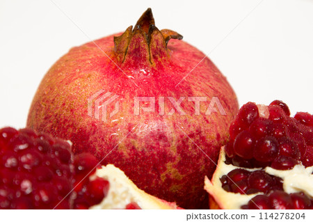 Purified pomegranate fruit on a white background 114278204