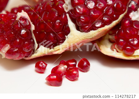 Purified pomegranate fruit on a white background 114278217