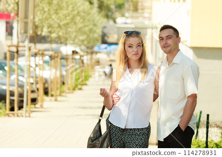Happy couple walking in city enjoying romance Happy couple walking in city enjoying romance 114278931