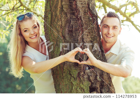 Happy couple having romantic date in park Happy couple having romantic date in park 114278953
