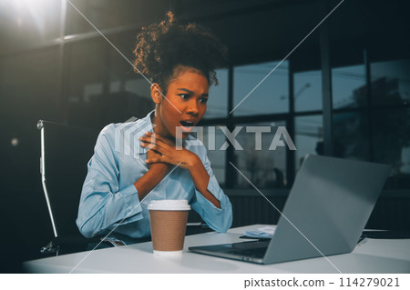 business woman sitting at work stressed , out working hard Feeling stressed out and dizzy from your job business woman sitting at work stressed , out working hard Feeling stressed out and dizzy from your job 114279021