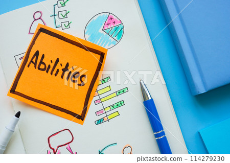 Notepad page with graphs and sticker with inscription abilities. Notepad page with graphs and sticker with inscription abilities. 114279230