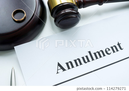 Papers about annulment, ring and gavel. 114279271