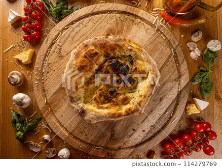 Delicious focaccia on wooden table 114279769