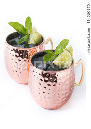 Moscow mule cocktail served with ice and lime slice isolated on white background 114280170