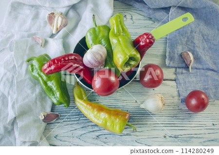fresh ripe assorted vegetables for cooking dinner on a wooden rustic table fresh ripe assorted vegetables for cooking dinner on a wooden rustic table 114280249