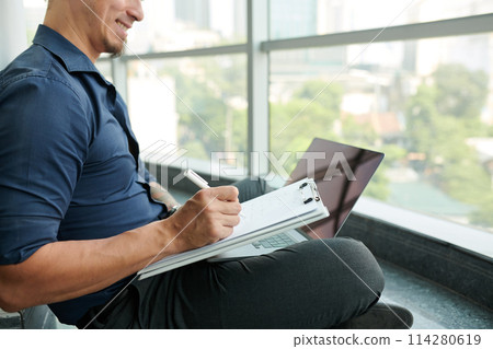 Businessman Working on Product Presentation Businessman Working on Product Presentation 114280619