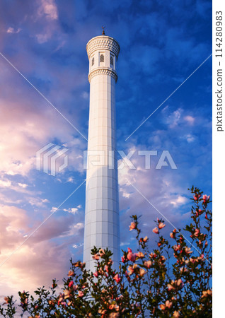 white minaret of modern marble new uzbek Masjid Minor Mosque in Tashkent on background of beautiful sky in spring 114280983