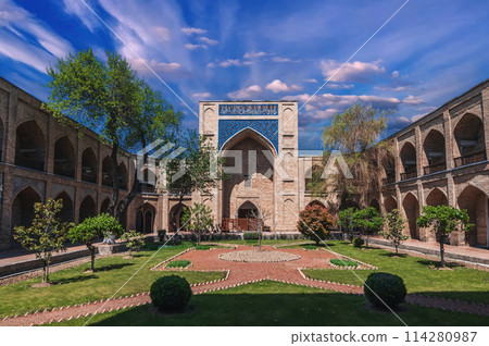 courtyard of ancient Uzbek Kukeldash Madrasah in Tashkent in Uzbekistan. Old medieval Islamic madrasa in summer 114280987