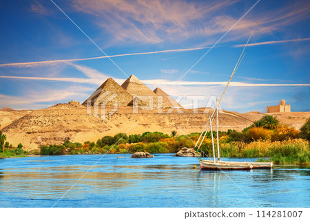 View on the Nile and the boats in the Aswan desert by the pyramids, Egypt 114281007