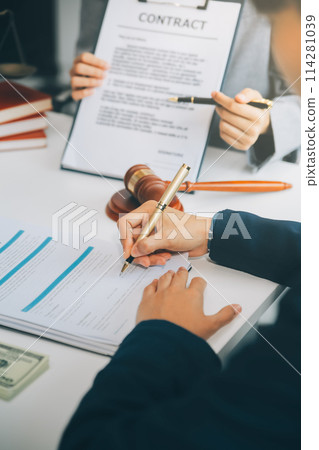 Businessman and lawyer discuss the contract document. Treaty of the law. Sign a contract business. Businessman and lawyer discuss the contract document. Treaty of the law. Sign a contract business. 114281039