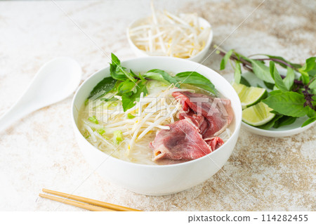 pho bo, vietnamese raw beef and rice noodle shoup pho bo, vietnamese raw beef and rice noodle shoup 114282455