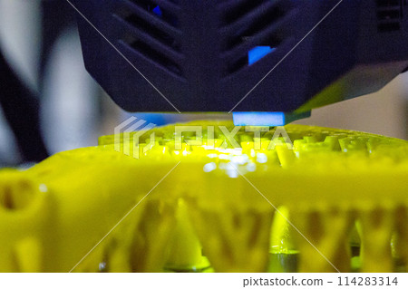 3D printer printing object close-up. Process creating three-dimensional model on 3d printer. Additive printer technology. 3D Prototyping. 3D design modeling. New modern innovation printing technology 3D printer printing object close-up. Process creating three-dimensional model on 3d printer. Additive printer technology. 3D Prototyping. 3D design modeling. New modern innovation printing technology 114283314