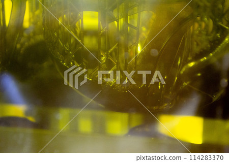 Working of photopolymer sla 3D printer. Platform with building object lowered into liquid photopolymer resins and hardened under ultraviolet laser. Progressive additive technology. 3D printer printing 114283370