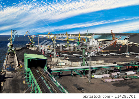 Maritime Bulk Terminal of Sea trade port with coal harbor and liquid cargo complex behind. Maritime Bulk Terminal of Sea trade port with coal harbor and liquid cargo complex behind. 114283701