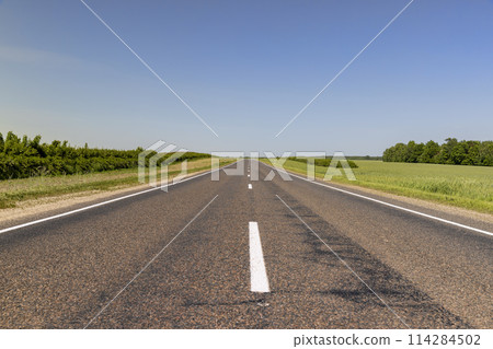 paved road with white line markings 114284502