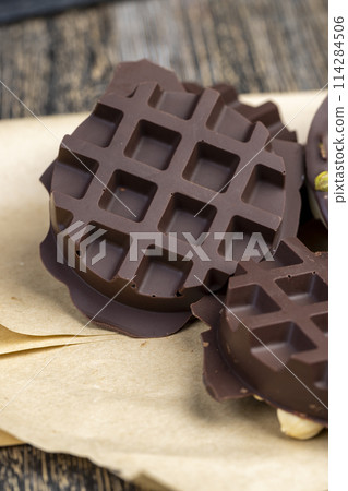 sweet chocolate with cocoa and nuts and other ingredients sweet chocolate with cocoa and nuts and other ingredients 114284506
