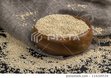 scattered white quinoa seeds, close up scattered white quinoa seeds, close up 114284534