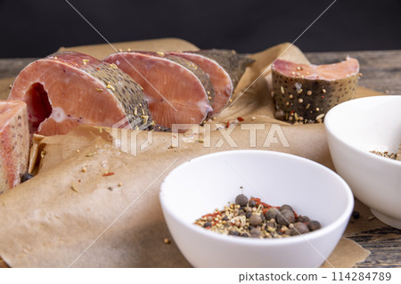 raw fish with red meat during cooking raw fish with red meat during cooking 114284789