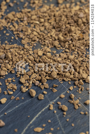 brown pieces of instant coffee for making a coffee drink 114284818