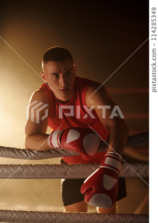 Young boxer having break between rounds Young boxer having break between rounds 114285349