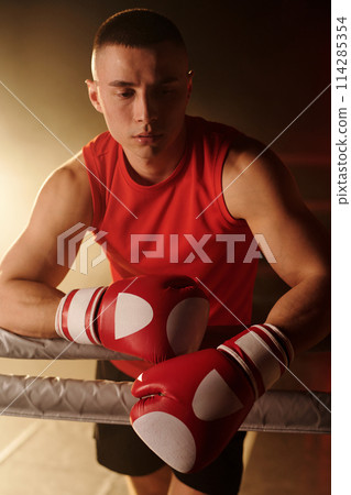 Tired guy having break between rounds 114285354