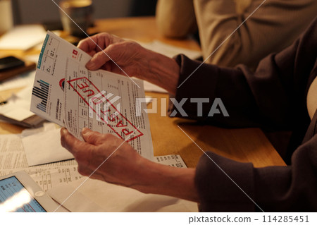 Housing payment bill with past due stamp 114285451