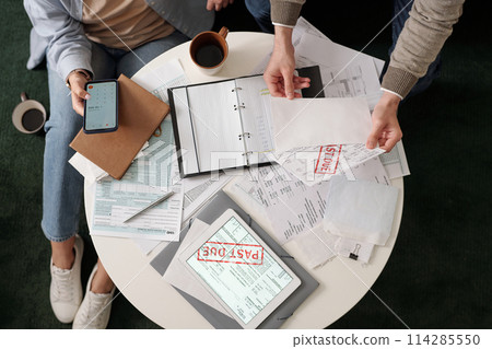 Checking bills and using calculator 114285550