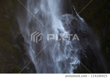 Waterfall in the forest, moss on rocks 114286925