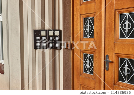 Intercom on a block of flats entrance door Intercom on a block of flats entrance door 114286926