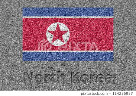 The North Korean flag painted on a stone slab and the words "North Korea" carved into it The North Korean flag painted on a stone slab and the words "North Korea" carved into it 114286957