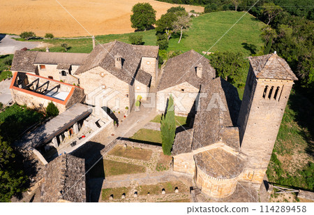 Aerial view of bell tower and apse of the Mozarab Pre-Romanesque or Romanesque Church of San Pedro de Larrede in the Serrablo Region. Spain 114289458