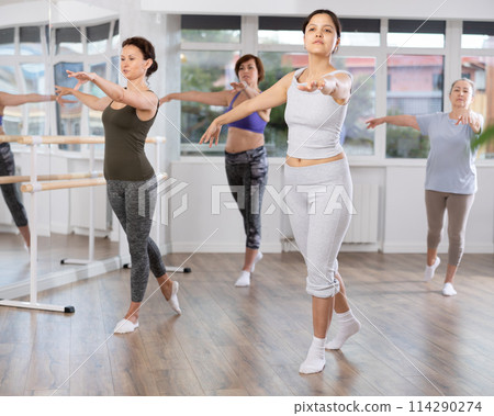 Asian woman participating in ballet class for beginners in choreography studio 114290274