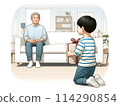 Boy giving a present to his father 114290854