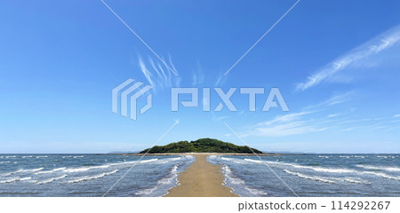 A road stretching across a crevice in the sea with a blue sky in the background A road stretching across a crevice in the sea with a blue sky in the background 114292267