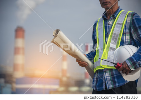 Senior Electrician engineer man hand holding red Walkie talkie communicate wear White hardhat at Power stations manufacturing electrical plant. Technician worker blue hard hat helmet Engineer industry Senior Electrician engineer man hand holding red Walkie talkie communicate wear White hardhat at Power stations manufacturing electrical plant. Technician worker blue hard hat helmet Engineer industry 114292310