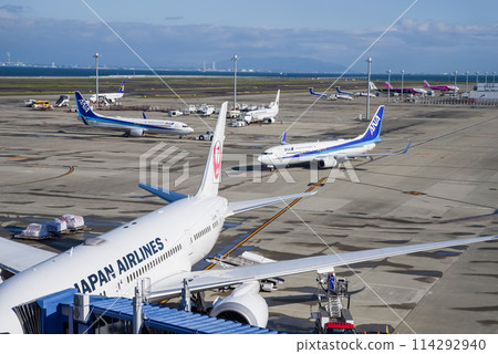 View from the Sky Deck at Chubu Centrair International Airport - Passenger planes parked on the apron View from the Sky Deck at Chubu Centrair International Airport - Passenger planes parked on the apron 114292940