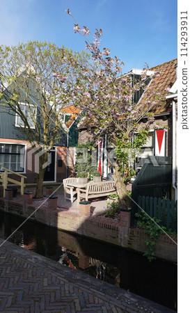 Beautiful wooden houses. Typical small Dutch houses facades in Volendam, Netherlands Beautiful wooden houses. Typical small Dutch houses facades in Volendam, Netherlands 114293911