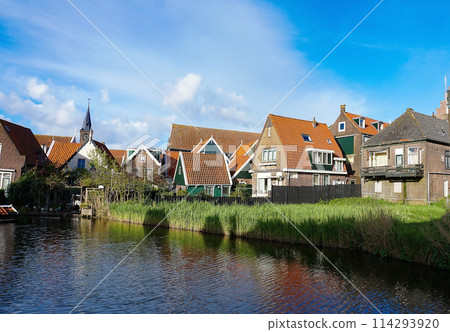Beautiful wooden houses. Typical small Dutch houses facades in Volendam, Netherlands Beautiful wooden houses. Typical small Dutch houses facades in Volendam, Netherlands 114293920