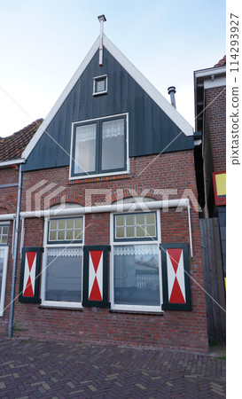 Beautiful wooden houses. Typical small Dutch houses facades in Volendam, Netherlands 114293927