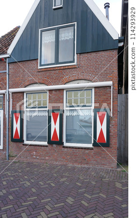 Beautiful wooden houses. Typical small Dutch houses facades in Volendam, Netherlands 114293929