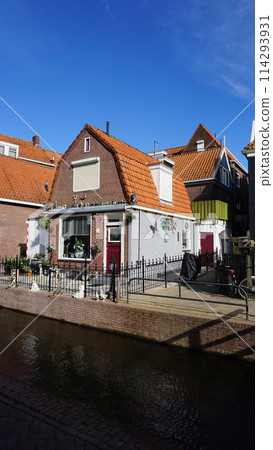 Beautiful wooden houses. Typical small Dutch houses facades in Volendam, Netherlands 114293931