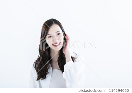 Woman smiling portrait white background long hair 114294060