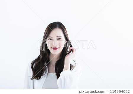 Woman smiling portrait white background long hair 114294062