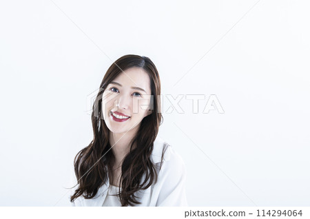 Woman smiling portrait white background long hair looking at camera 114294064
