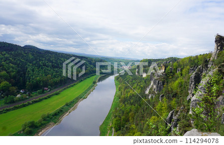 Beautiful summer view of Elbe river from Bastei view pont. Colorful morning scene of Saxon Switzerland national park, Germany, Europe. 114294078